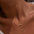 Colar estrela e concha, Aço banhado a ouro 18K